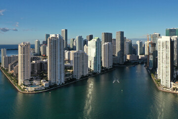 Miami, Florida - December 27, 2020 - Aerial view of City of Miami and entrance to Miami River on sunny winter morning.