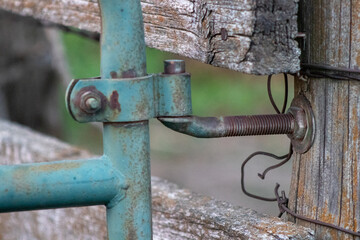 Close up of old wooden fence and gate in pasture
