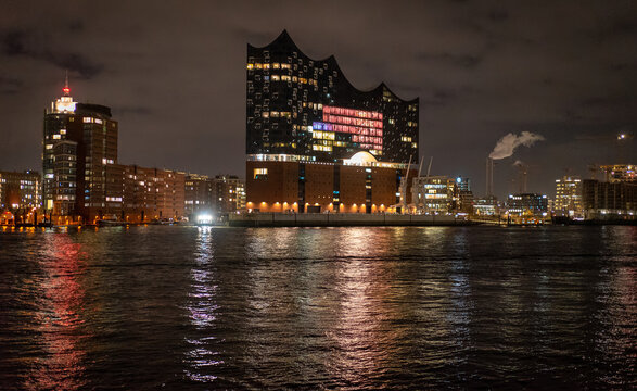 Beautiful harbour of Hamburg with Elbphilharmonie concert hall by night - travel photography