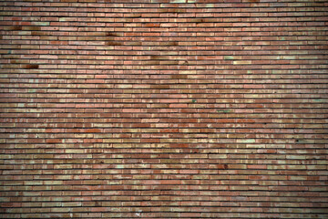 URBAN OLD BRICK WALL IN AN INDUSTRIAL ESTATE. TEXTURES AND BACKGROUND CONCEPT. COPY SPACE.