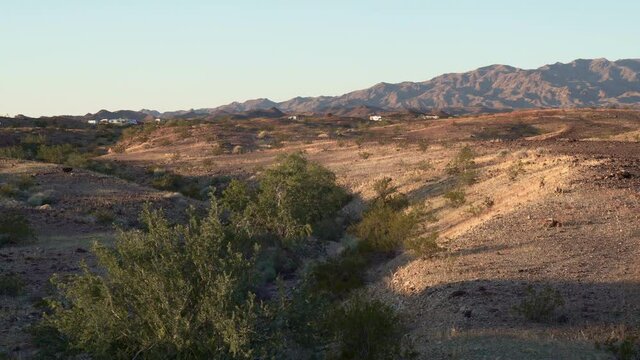 Camping at BLM land (Bureau of Land Management) also called Boondocking (Free Camping), at sunset at the beautiful wilderness desert of Earp, CA, USA. Pan.