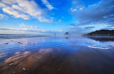 Cannon Beach on a msty Winter afternoon, with Haystack Rock and the Needles facing into the haze 