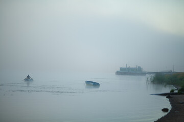 Fog on the river and a boat.