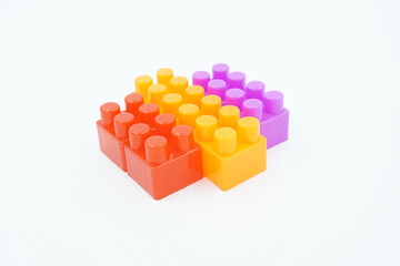 Obraz premium colored stacking blocks on a white background