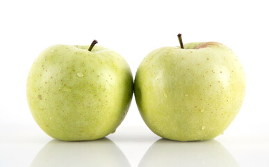 Two green apples on white background