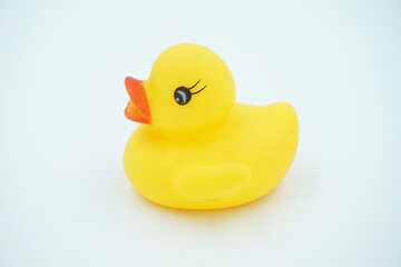 Yellow duckling toy on white background
