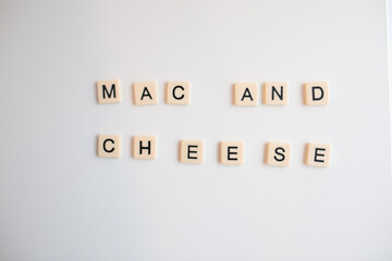 flat lay scrabble tiles spelling out mac and cheese