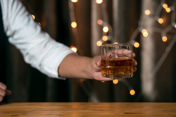 Barman pouring whiskey whiskey glass beautiful night
