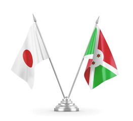 Burundi and Japan table flags isolated on white 3D rendering
