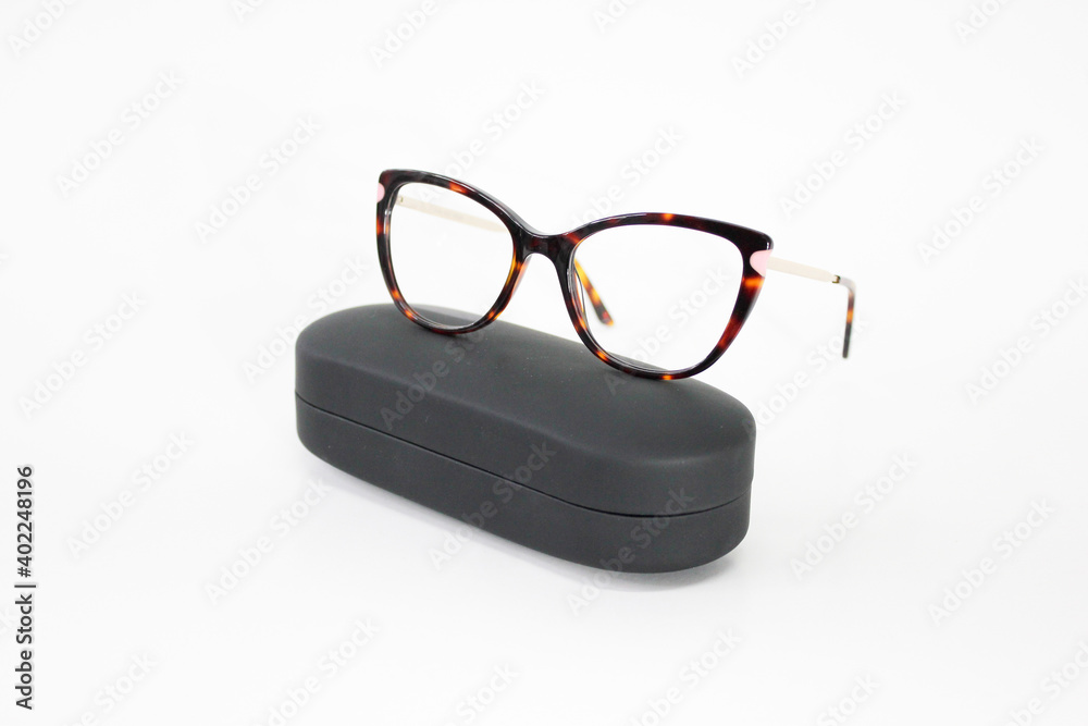 Wall mural Optic glasses white background with case