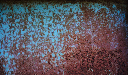 Old rusty and scratched metal wall, grunge texture with brown and greenish blue colors. Can be used as background.