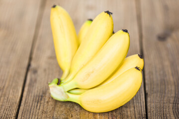 ripe banana tropical fruit on wooden background, fresh banana.