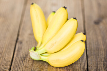 Fototapeta na wymiar ripe banana tropical fruit on wooden background, fresh banana.