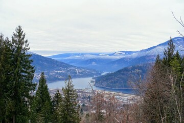 A faraway view looking down on the town of Nelson during the winter with lake Kootenay in the background, in British Columbia, Canada