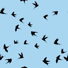 Swallows seamless pattern. Black silhouettes of birds on a blue background.
