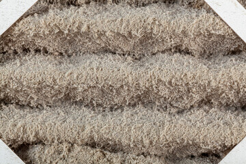 A heavily clogged furnace air filter. These filters are used to remove dust, allergens, microbes...