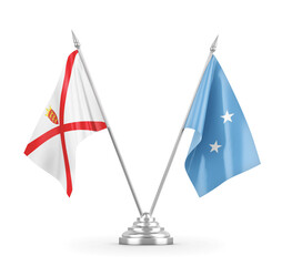 Micronesia and Jersey table flags isolated on white 3D rendering