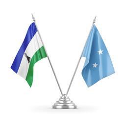 Micronesia and Lesotho table flags isolated on white 3D rendering