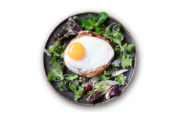 top view of a typical portuguese dish,  Alheira (in portuguese) with egg and salad - mediterranean food.