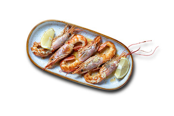 grilled prawns served with lemon on a white background - selective focus.