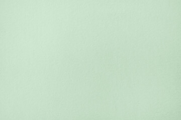 Green pastel color paper texture background or cardboard surface from a paper box for packing. and...