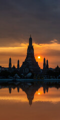 Silhouette of Wat Arun Temple in Bangkok Thailand at sunset.