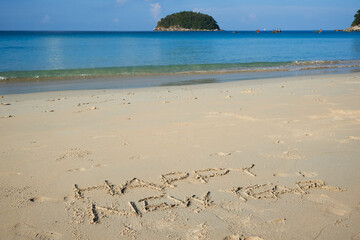 Happy new year letter on the beach