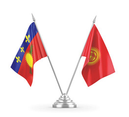 Kyrgyzstan and Guadeloupe table flags isolated on white 3D rendering