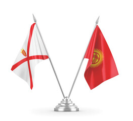 Kyrgyzstan and Jersey table flags isolated on white 3D rendering