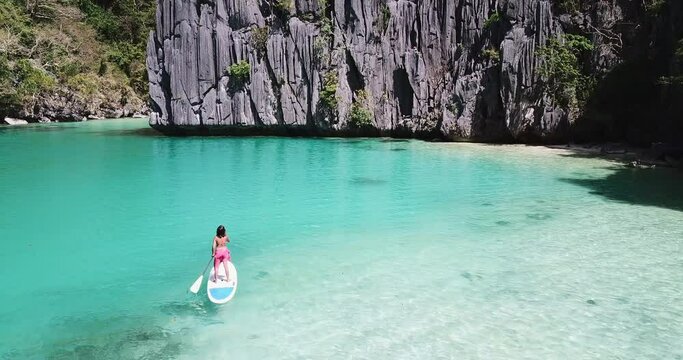 Aerial view of woman stand up paddling, El Nido, Palawan, Philippines