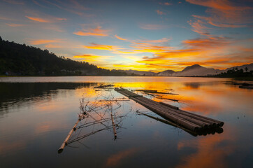 sunset on the lake tarusan kamang, west sumatera, indonesia 