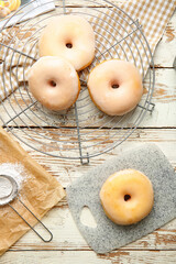 Tasty donuts on wooden background