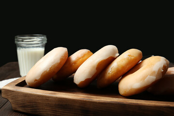 Tasty donuts on wooden table