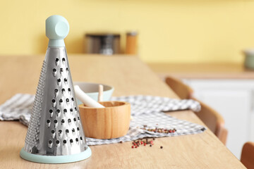 Grater, mortar and pestle on kitchen counter