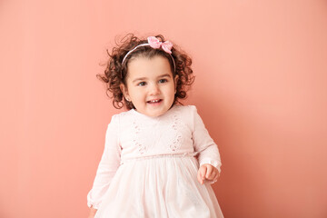 Cute baby girl on color background