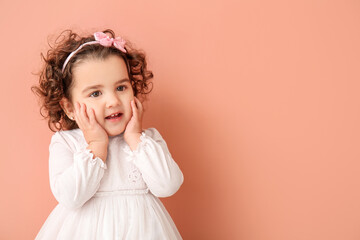 Cute baby girl on color background