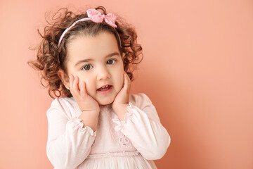 Cute baby girl on color background