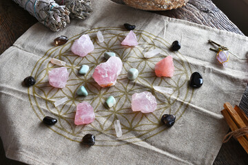 A close up image of a self love and self healing crystal grid using sacred geometry and rose quartz crystals.  - obrazy, fototapety, plakaty