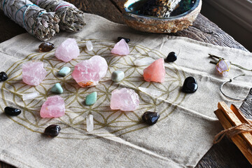 A close up image of a self love and self healing crystal grid using sacred geometry and rose quartz...