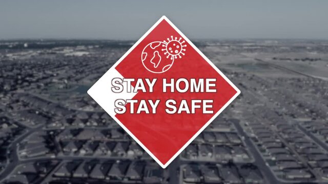 Stay Home Stay Safe Motion Graphic displays over an aerial view of a neighborhood.