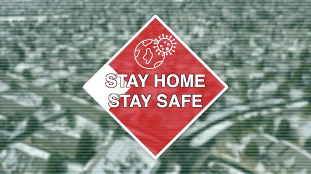 Stay Home Stay Safe Motion graphic displays over an aerial view of a neighborhood.