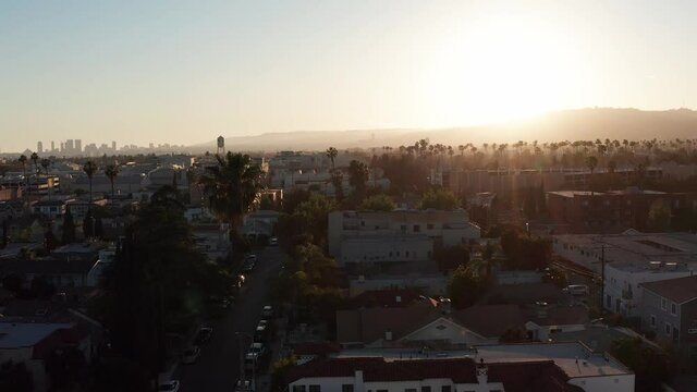 Aerial rising shot of the Hollywood sprawl at sunset. 4K