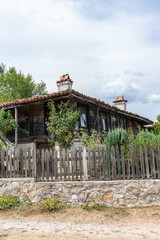 Old wooden and stone house in a village