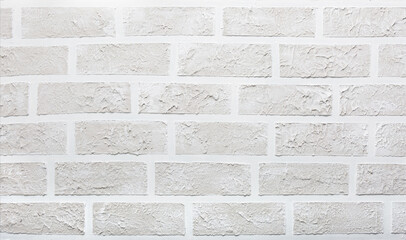 Grey brick wall imitation texture. White and beige plaster background.