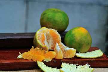 Orange fruit on a wooden board