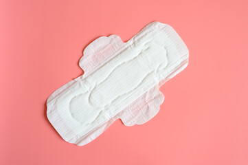 pure empty women's disposable menstrual sanitary pad or napkin for normal abundance of secretions on pink background
