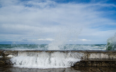 Waves on harbor wall