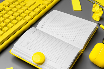Open yellow notepad and keyboard on gray background