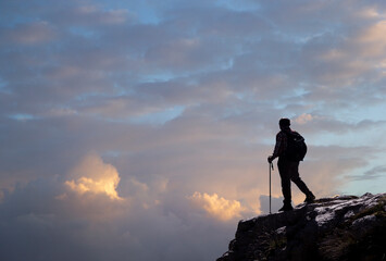hiker on the top of a mountain in matese park in the clouds