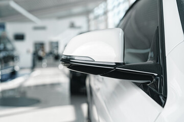 Mirror of a new white luxury car